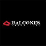 Balcones Distilling logo with red emblem on a black background.