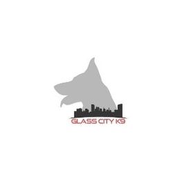 Silhouette of a dog's head and city skyline with text "Glass City K9" beneath.