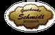 Goldfarbenes Schild mit der Aufschrift: "Geschenke Schmidt Wittstock" auf rotem Hintergrund.