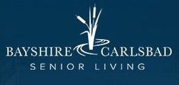 Logo of Bayshire Carlsbad Senior Living with stylized reeds on a dark blue background.