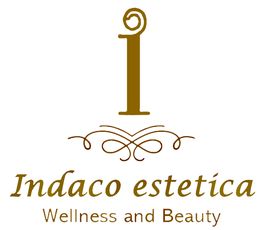 Logo di "Indaco estetica" con scritta "Wellness and Beauty" e decorazioni stilizzate.