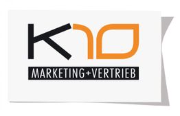 Logo mit Schriftzug "K10 Marketing+Vertrieb" in schwarzer und orangener Farbe auf weißem Hintergrund.
