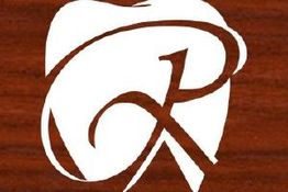 Stylized "R" in white over brown wooden texture background.