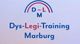 Logo mit der Aufschrift "Dys-Legi-Training Marburg" in Blau und Rot unter einem Bogen.