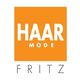Oranje vierkant met de tekst "HAARMODE FRITZ" in witte letters op witte achtergrond.