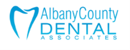 Logo of Albany County Dental Associates, features a tooth outline and blue text.