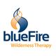 Logo of blueFire Wilderness Therapy with a blue and orange flame design.