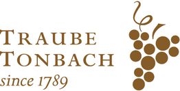 Logo von Traube Tonbach mit dem Text "since 1789" und einer stilisierten Weintraube.