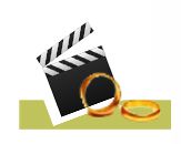 Filmklappe und zwei goldene Ringe auf grünem Hintergrund.