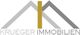 Logo mit zwei grauen Dächern und dem Text "Krueger Immobilien" in Grau und Gold.