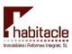 Logotipo de Habitacle, empresa de reformas integrales, con un diseño en tonos marrones.