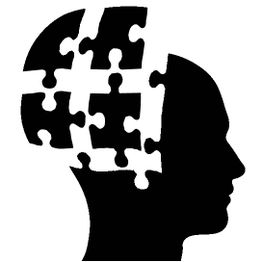 Silhouette eines Kopfes mit fehlenden Puzzleteilen im Gehirnbereich.