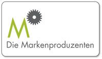Logo mit grünem "M", grauem Zahnrad und Text "Die Markenproduzenten" in einem weißen Rechteck.