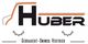 Logo von Huber Gebraucht-Unimog Vertrieb mit stilisiertem Unimog-Design und Zahnradmotiven.