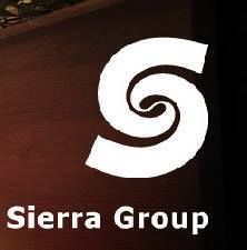 Stylized "S" logo of Sierra Group on a wooden background.