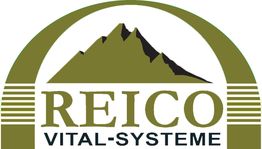 Logo mit Bergsilhouette und Schriftzug "Reico Vital-Systeme" in grünen und schwarzen Farben.