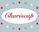 Text "Chariscap" in rotem Skript auf grauem Hintergrund mit kleinen roten und weißen Herzen.