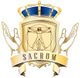 Escudo con corona azul, figura de Vitruvio en el centro y cinta con "SACRUM" en la parte inferior.