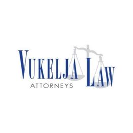 Vukelja Law Attorneys logo with scales of justice graphic.