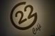 Logo del "Cafè 22" su sfondo bianco.