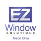 Logo of EZ Window Solutions in Akron, Ohio with a purple and white design.