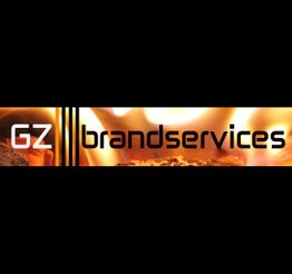 Logo mit Flammenhintergrund: "GZ brandservices" in schwarzer Schrift auf orangefarbenem Grund.