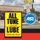 All Tune and Lube sign with ASE certification badge in front of auto service shop.