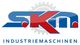 Logo mit Schriftzug "S.K.M. Industriemaschinen" und Zahnradgrafik im Hintergrund.