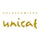 "Logo: Goldschmiede unicat, goldene Schrift auf weißem Hintergrund."