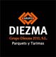 Logotipo de Grupo Diezma 2010, S.L., parquets y tarimas, fondo negro, texto en blanco y naranja.