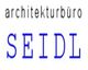 Textlogo mit Aufschrift "architekturbüro SEIDL" in schwarzer und blauer Schrift.