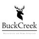 Silhouette of a deer head above "BuckCreek" and "Restoration and Home Solutions" text.