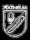 Wappen mit Lampe und Säbel, darüber der Schriftzug "AXTHELM" in stilisierter Schrift.