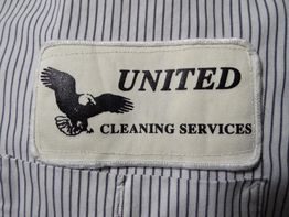 Badge reading "United Cleaning Services" with an eagle design on a striped fabric background.