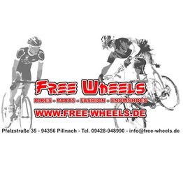 Zwei Radfahrer mit rotem "Free Wheels"-Logo und Kontaktinfos für ein Fahrradgeschäft.