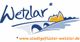 Logo mit "Wetzlar", stilisierter Brücke und Gebäude. Webseite: stadtgeflüster-wetzlar.de