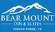 Logo of Bear Mount Inn & Suites with mountain design, located in Pigeon Forge, TN.