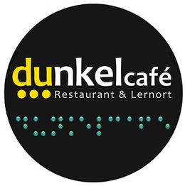 Logo "dunkelcafé" mit Blindenschrift, Text: "Restaurant & Lernort", schwarzer Hintergrund.
