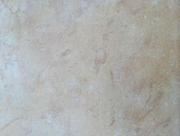 Beige Marmor- oder Steintextur mit feinen, natürlichen Mustern und Verfärbungen.