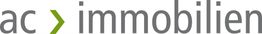 Logo mit Schriftzug "ac > immobilien" in Grau und Grün.