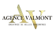 Logo de l'Agence Valmont, texte doré sur fond transparent.