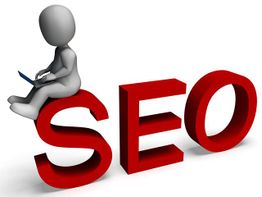 Figure with laptop sitting on large red "SEO" letters.