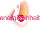 Logodesign mit Wort "energieeinheit" in Rot, stilisierter Fußabdruck in Rot-Orange im Hintergrund.