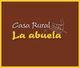 Texto blanco y amarillo: "Casa Rural La abuela" con dibujo de chimenea sobre fondo marrón.