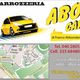 Cartolina pubblicitaria di una carrozzeria con auto gialla e mappa di Trieste. Contatti inclusi.
