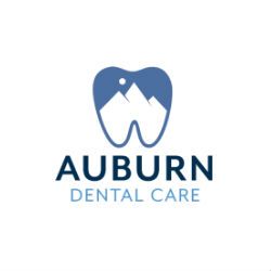 Logo of Auburn Dental Care with a tooth icon and mountain design.