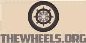 Logo with a detailed wheel illustration above the text "THEWHEELS.ORG" on a beige background.
