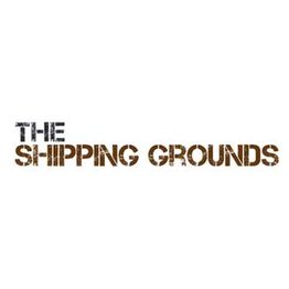 Text logo: "The Shipping Grounds" in distressed black and brown lettering.