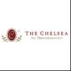 Logo for "The Chelsea at Brookhaven" with a maroon emblem and decorative leaves.