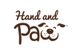 Logo reading "Hand and Paw" with the word "Paw" designed as a dog's face.